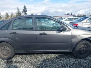 2006 Ford Focus S z VIN 1FAFP34NX6W179320, wystawiony jako IAAI lot #41937794 z przebiegiem 211 961 mil mil oraz . Historia ofert i sprzedaży dostępna na DreamBid. Obrazek 12.