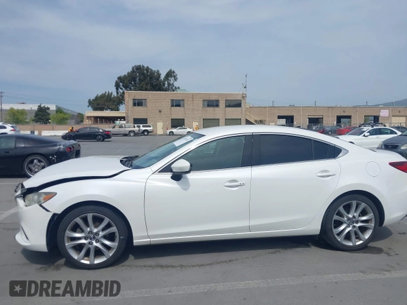 2016 Mazda Mazda6 i Touring with VIN JM1GJ1V57G1429887, listed as a IAAI auction lot 42029170 with 140,519 mi miles. Bid and sale history available at carsss.com. Image 14.