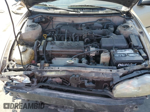 1997 Geo Prizm LSi z VIN 1Y1SK5263VZ408119, wystawiony jako Copart lot #52308235 z przebiegiem 344 971 mil mil oraz Szkody całkowita. Historia ofert i sprzedaży dostępna na DreamBid. Obrazek 11.