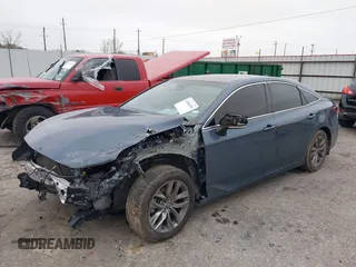 2022 Toyota Avalon XLE z VIN 4T1JZ1FB2NU073049, wystawiony jako IAAI lot #41506550 z przebiegiem 52 073 mil mil oraz . Historia ofert i sprzedaży dostępna na DreamBid. Obrazek 17.