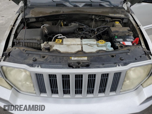 2012 Jeep Liberty Sport z VIN 1C4PJLAK4CW180680, wystawiony jako Copart lot #59358785 z przebiegiem 137 036 mil mil oraz Szkoda całkowita • Salvage title. Historia ofert i sprzedaży dostępna na DreamBid. Obrazek 12.