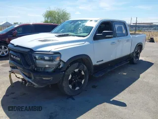 2022 Ram 1500 Rebel z VIN 1C6SRFLT4NN357352, wystawiony jako IAAI lot #41881613 z przebiegiem 31 285 mil mil oraz . Historia ofert i sprzedaży dostępna na DreamBid. Obrazek 16.