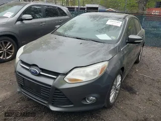 2012 Ford Focus SEL with VIN 1FAHP3H23CL348356, listed as a IAAI auction lot 42041001 with 174,510 mi miles. Bid and sale history available at carsss.com. Image 2.