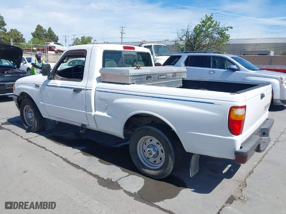 2003 Mazda B-Series 2WD Truck SX with VIN 4F4YR12D53TM11564, listed as a IAAI auction lot 42028399 with 218,402 mi miles. Bid and sale history available at carsss.com. Image 3.