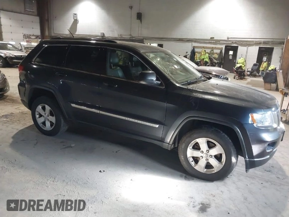 2013 Jeep Grand Cherokee Laredo with VIN 1C4RJFAG9DC583269, listed as a IAAI auction lot 41241085 with 147,995 mi miles. Bid and sale history available at carsss.com. Image 1.