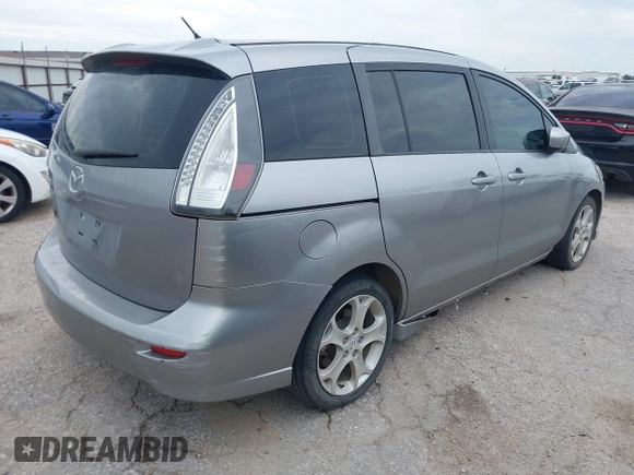 2010 Mazda 5 Sport with VIN JM1CR2WL8A0387155, listed as a IAAI auction lot 42773874 with 146,418 mi miles and . Bid and sale history available at DreamBid. Image 4.