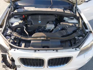 2015 BMW X1 xDrive28i with VIN WBAVL1C50FVY26009, listed as a IAAI auction lot 41495667 with 109,807 mi miles. Bid and sale history available at carsss.com. Image 10.