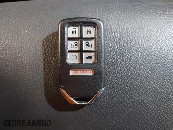 2021 Honda Odyssey Touring with VIN 5FNRL6H83MB040138, listed as a IAAI auction lot 39150096 with 61,322 mi miles and . Bid and sale history available at DreamBid. Image 11.