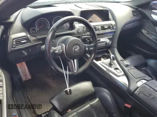 2016 BMW M6 z VIN WBS6E9C51GG437085, wystawiony jako Copart lot #78982124 z przebiegiem Nie podano mil oraz Szkody całkowita. Historia ofert i sprzedaży dostępna na DreamBid. Obrazek 8.