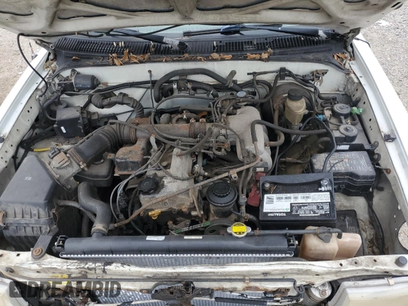 1999 Toyota Tacoma z VIN 4TAVL52N6XZ555376, wystawiony jako Copart lot #85763154 z przebiegiem 229 914 mil mil oraz Nie do naprawy • Non repairable. Historia ofert i sprzedaży dostępna na DreamBid. Obrazek 11.