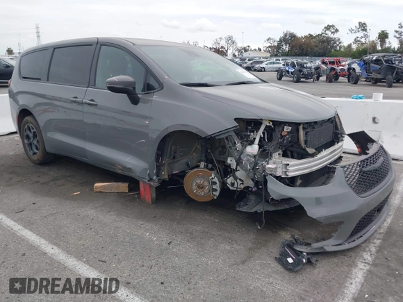 2023 Chrysler Pacifica Hybrid Touring L with VIN 2C4RC1L71PR584485, listed as a IAAI auction lot 42056423 with 58,955 mi miles and . Bid and sale history available at DreamBid. Image 1.