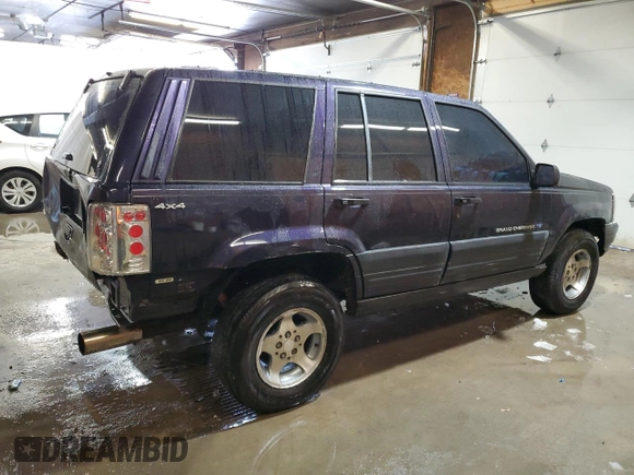 1997 Jeep Grand Cherokee Laredo with VIN 1J4GZ58Y7VC678708, listed as a Copart auction lot 87803725 with 312,585 mi miles and Salvage Title. Bid and sale history available at carsss.com. Image 3.