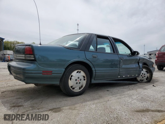 1997 Oldsmobile Cutlass Supreme S z VIN 1G3WH52MXVF317238, wystawiony jako Copart lot #53523905 z przebiegiem 135 925 mil mil oraz Szkody całkowita. Historia ofert i sprzedaży dostępna na DreamBid. Obrazek 3.