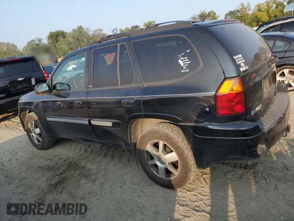 2004 GMC Envoy SLT with VIN 1GKDT13S942407244, listed as a Copart auction lot 70995064 with 162,676 mi miles and Salvage Title. Bid and sale history available at carsss.com. Image 2.