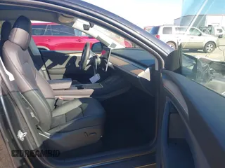 2024 Tesla Model Y Long Range with VIN 7SAYGDEE8RA293641, listed as a IAAI auction lot 41891018 with 7,341 mi miles and . Bid and sale history available at DreamBid. Image 5.