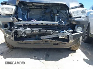 2023 Toyota Tacoma SR5 z VIN 3TMAZ5CN8PM201702, wystawiony jako IAAI lot #42060855 z przebiegiem 17 705 mil mil oraz . Historia ofert i sprzedaży dostępna na DreamBid. Obrazek 18.