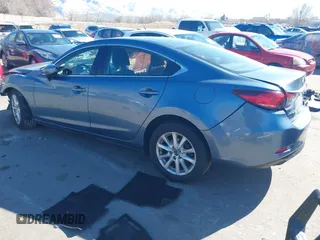 2016 Mazda 6 i Sport with VIN JM1GJ1U57G1451597, listed as a IAAI auction lot 41658184 with 142,504 mi miles and . Bid and sale history available at DreamBid. Image 3.