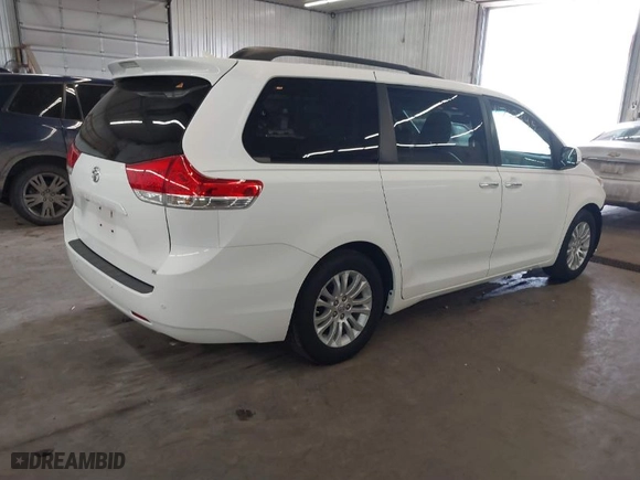 2012 Toyota Sienna XLE AAS with VIN 5TDYK3DC2CS196897, listed as a IAAI auction lot 41762345 with 183,188 mi miles. Bid and sale history available at carsss.com. Image 4.