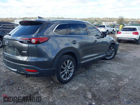 2019 Mazda CX-9 Signature with VIN JM3TCBEYXK0324257, listed as a IAAI auction lot 41986590 with Not provided miles and . Bid and sale history available at DreamBid. Image 4.