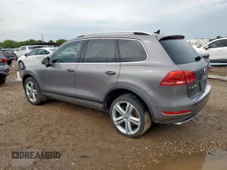 2011 Volkswagen Touareg Sport z VIN WVGFK9BP5BD001915, wystawiony jako Copart lot #58965625 z przebiegiem 181 765 mil mil oraz Szkoda całkowita • Salvage title. Historia ofert i sprzedaży dostępna na DreamBid. Obrazek 2.