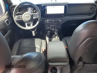 2024 Jeep Wrangler Sahara with VIN 1C4RJXP60RW163829, listed as a Copart auction lot 57182365 with 16,873 mi miles and Salvage title. Bid and sale history available at DreamBid. Image 8.