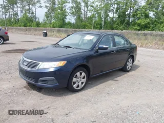 2010 Kia Optima LX z VIN KNAGG4A89A5400338, wystawiony jako IAAI lot #42410076 z przebiegiem 253 870 mil mil oraz . Historia ofert i sprzedaży dostępna na DreamBid. Obrazek 2.