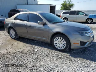 2010 Ford Fusion Hybrid with VIN 3FADP0L3XAR327449, listed as a Copart auction lot 54207225 with 192,659 mi miles and Salvage Title. Bid and sale history available at carsss.com. Image 4.