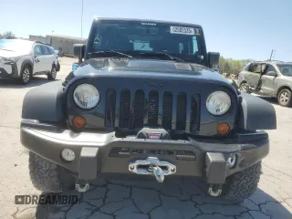 2013 Jeep Wrangler Sahara with VIN 1C4AJWBG8DL602065, listed as a Copart auction lot 52082535 with 110,727 mi miles and Salvage title. Bid and sale history available at DreamBid. Image 5.