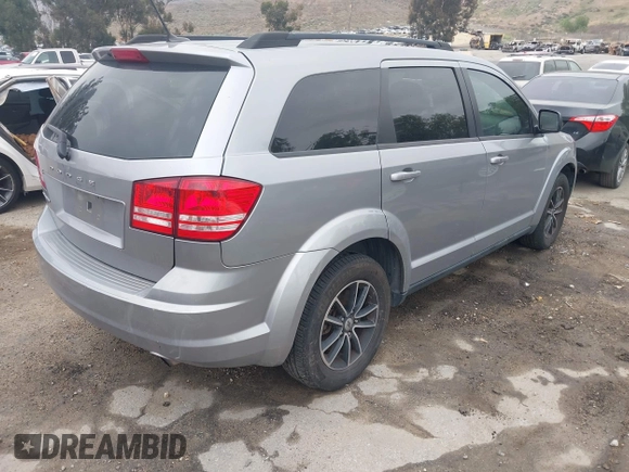 2018 Dodge Journey SE with VIN 3C4PDCAB1JT141295, listed as a IAAI auction lot 42098218 with 110,691 mi miles. Bid and sale history available at carsss.com. Image 4.