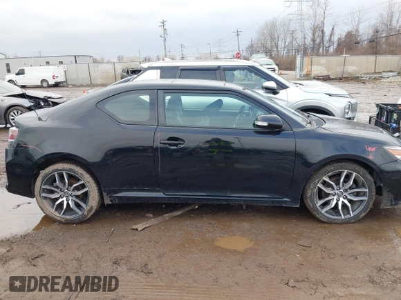 2014 Scion tC with VIN JTKJF5C74E3069104, listed as a IAAI auction lot 41579797 with 130,668 mi miles. Bid and sale history available at carsss.com. Image 13.