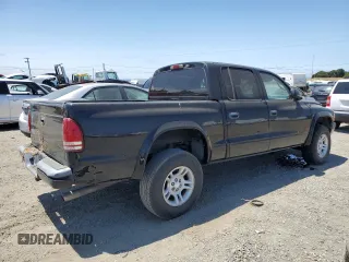 2001 Dodge Dakota Sport z VIN 1B7HG2AN61S316996, wystawiony jako Copart lot #58677535 z przebiegiem 164 628 mil mil oraz Tytuł czysty. Historia ofert i sprzedaży dostępna na DreamBid. Obrazek 3.