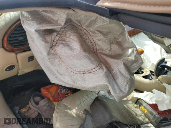 1999 Jaguar XK with VIN SAJGX204XXC038435, listed as a Copart auction lot 64843714 with Not Provided miles and Salvage Title. Bid and sale history available at DreamBid. Image 8.