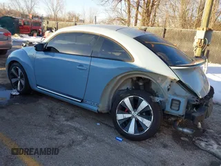 2014 Volkswagen Beetle Turbo R-Line with VIN 3VWVT7AT9EM661347, listed as a IAAI auction lot 41336295 with 61,068 mi miles and . Bid and sale history available at DreamBid. Image 3.