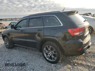 2012 Jeep Grand Cherokee SRT8 with VIN 1C4RJFDJ2CC265421, listed as a Copart auction lot 48654325 with 115,514 mi miles and Salvage Title. Bid and sale history available at carsss.com. Image 2.