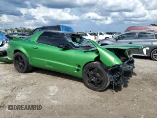 2001 Pontiac Firebird Formula z VIN 2G2FV22G412115819, wystawiony jako Copart lot #70310714 z przebiegiem 203 067 mil mil oraz Szkody całkowita. Historia ofert i sprzedaży dostępna na DreamBid. Obrazek 4.