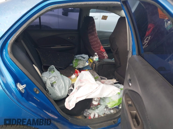 2009 Toyota Yaris with VIN JTDBT903591323255, listed as a IAAI auction lot 41933401 with 88,558 mi miles and . Bid and sale history available at DreamBid. Image 8.