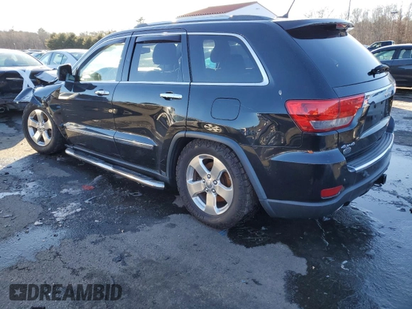 2013 Jeep Grand Cherokee Overland with VIN 1C4RJFCTXDC525097, listed as a Copart auction lot 42250875 with 214,368 mi miles and Salvage Title. Bid and sale history available at carsss.com. Image 2.