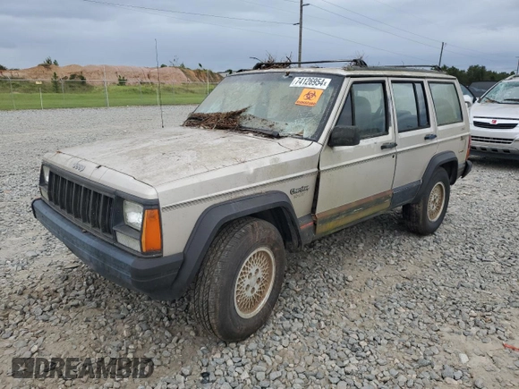 1995 Jeep Cherokee Sport with VIN 1J4FJ68S4SL618773, listed as a Copart auction lot 74126954 with 318,519 mi miles and Salvage title. Bid and sale history available at DreamBid. Image 1.