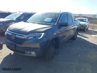 2020 Honda Ridgeline RTL-E with VIN 5FPYK3F72LB011694, listed as a IAAI auction lot 41628184 with 76,011 mi miles. Bid and sale history available at carsss.com. Image 2.