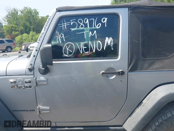 2015 Jeep Wrangler Freedom Edition with VIN 1C4AJWAG4FL589769, listed as a IAAI auction lot 42704488 with 194,414 mi miles and . Bid and sale history available at DreamBid. Image 14.