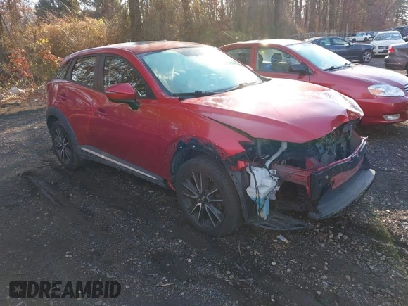 2017 Mazda CX-3 Grand Touring with VIN JM1DKFD77H0165528, listed as a IAAI auction lot 40942595 with 89,648 mi miles. Bid and sale history available at carsss.com. Image 1.