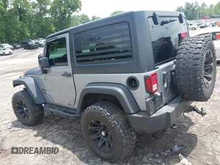 2016 Jeep Wrangler Black Bear with VIN 1C4AJWAG5GL258426, listed as a IAAI auction lot 42400914 with 128,606 mi miles and . Bid and sale history available at DreamBid. Image 3.