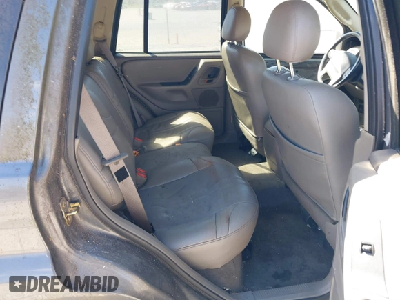 2002 Jeep Grand Cherokee z VIN 1J4GX38S92C149908, wystawiony jako IAAI lot #41782530 z przebiegiem 145 195 mil mil oraz . Historia ofert i sprzedaży dostępna na DreamBid. Obrazek 8.