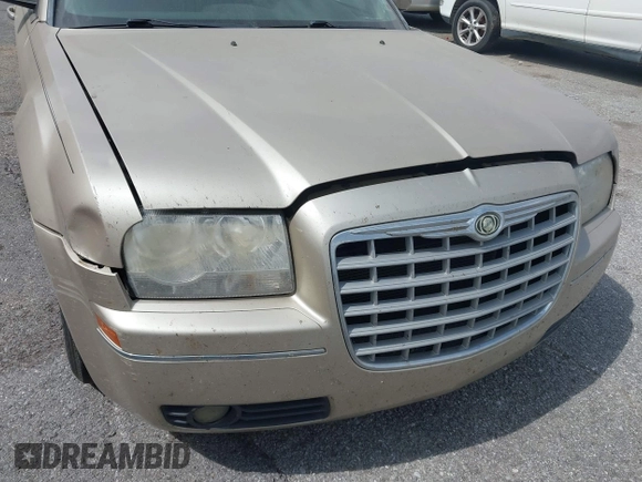 2006 Chrysler 300 Touring with VIN 2C3KA53G56H309497, listed as a IAAI auction lot 41792324 with 128,492 mi miles. Bid and sale history available at carsss.com. Image 6.