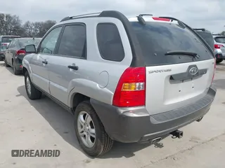 2005 Kia Sportage LX with VIN KNDJF723757087655, listed as a IAAI auction lot 41706354 with 164,736 mi miles and . Bid and sale history available at carsss.com. Image 3.