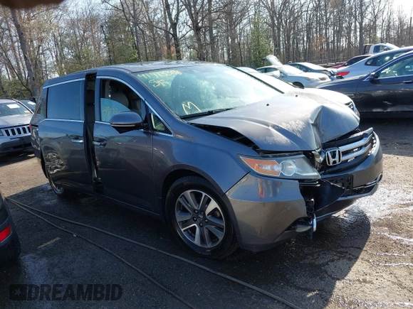 2015 Honda Odyssey Touring Elite z VIN 5FNRL5H9XFB067679, wystawiony jako IAAI lot #41913306 z przebiegiem 199 482 mil mil oraz . Historia ofert i sprzedaży dostępna na DreamBid. Obrazek 1.
