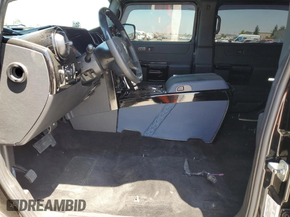 2005 Hummer H2 SUV z VIN 5GRGN23U05H117630, wystawiony jako Copart lot #57087305 z przebiegiem 60 260 mil mil oraz Szkoda całkowita • Salvage title. Historia ofert i sprzedaży dostępna na DreamBid. Obrazek 7.