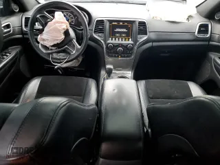 2018 Jeep Grand Cherokee Altitude with VIN 1C4RJFAGXJC122688, listed as a Copart auction lot 61290525 with 106,671 mi miles and Salvage title. Bid and sale history available at DreamBid. Image 8.