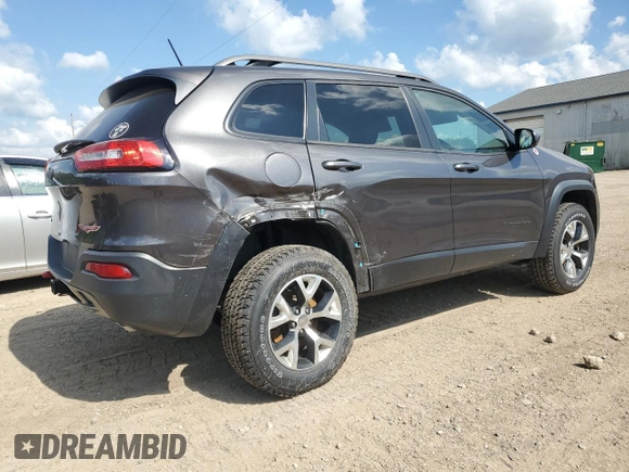 2014 Jeep Cherokee Trailhawk with VIN 1C4PJMBS4EW187085, listed as a Copart auction lot 64106985 with 166,467 mi miles and Clean title. Bid and sale history available at DreamBid. Image 3.