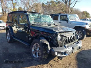 2021 Jeep Wrangler Unlimited Sahara z VIN 1C4HJXEN4MW714133, wystawiony jako IAAI lot #41241040 z przebiegiem 82 247 mil mil oraz . Historia ofert i sprzedaży dostępna na DreamBid. Obrazek 1.